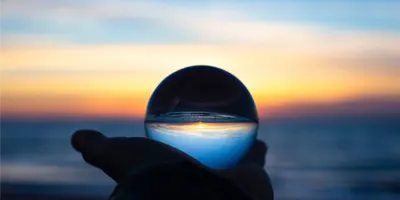 beach-sunset-in-handheld-snow-globe