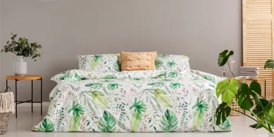 digitally-printed-comforter-on-bed-with-printed-green-plants