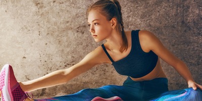 woman-stretches-wearing-digitally-printed-yoga-workout-clothes