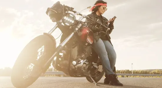 woman-leans-against-motorcycle