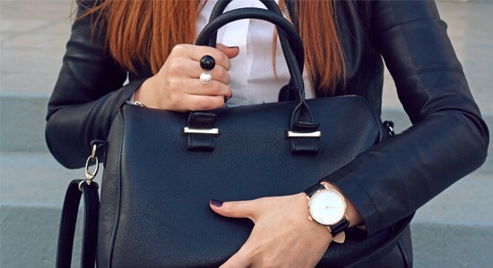 woman-holding-leather-purse